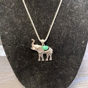 Silver tone and faux stone elephant necklace